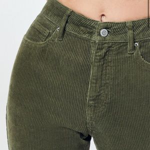High-waisted green corduroy pants